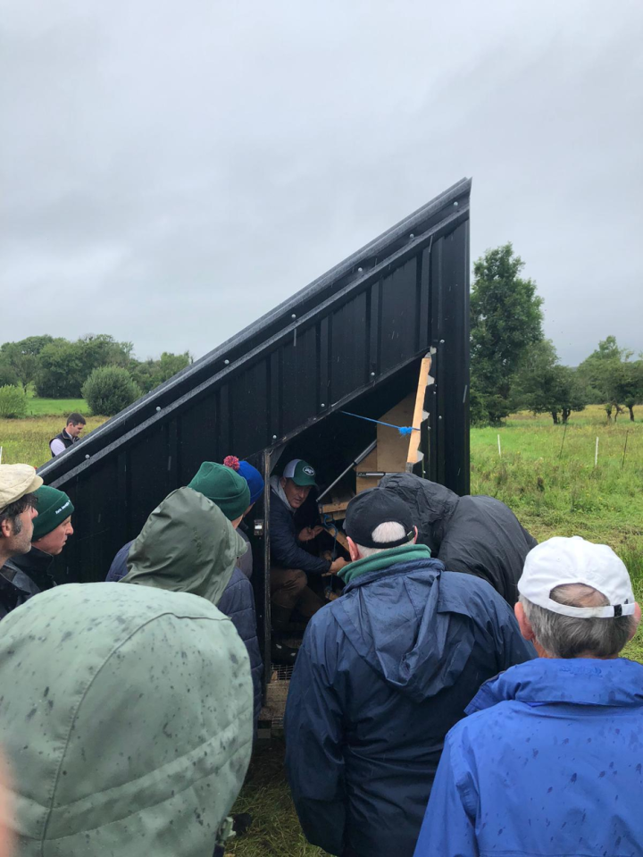 James Gilmartin showing how his transportable hen house operates